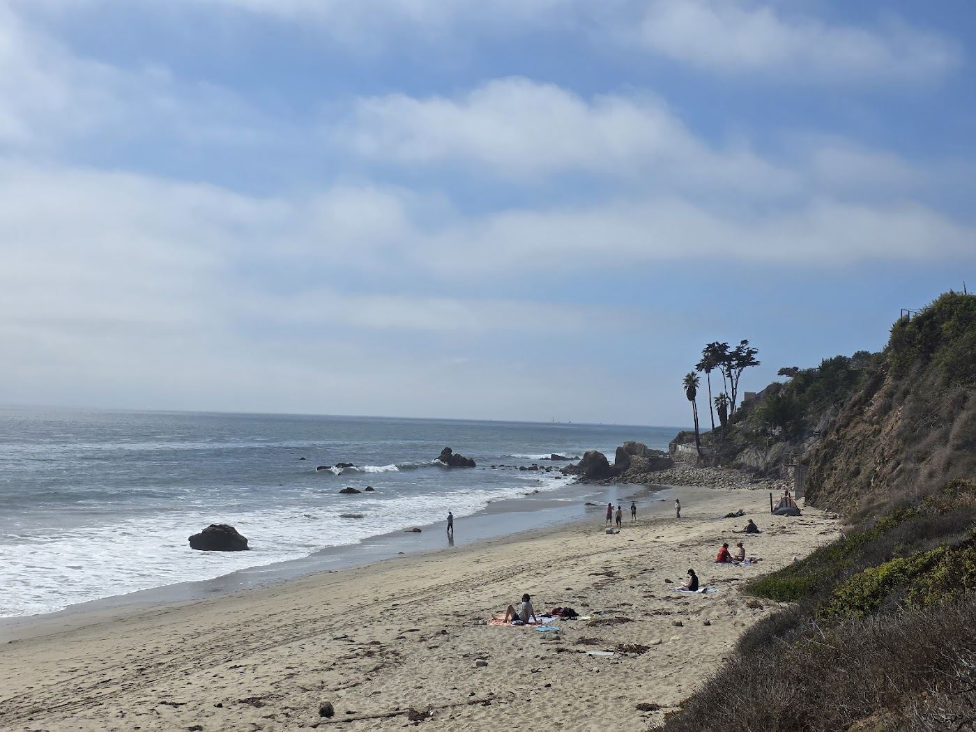 The quiet pocket cove of El Pescador Beach below the bluffs in Malibu
