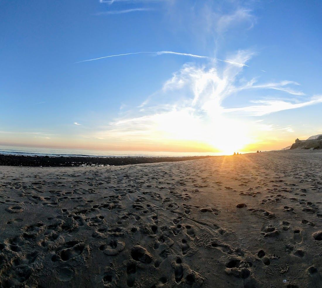 The creek mouth and right point break at Topanga State Beach in Malibu