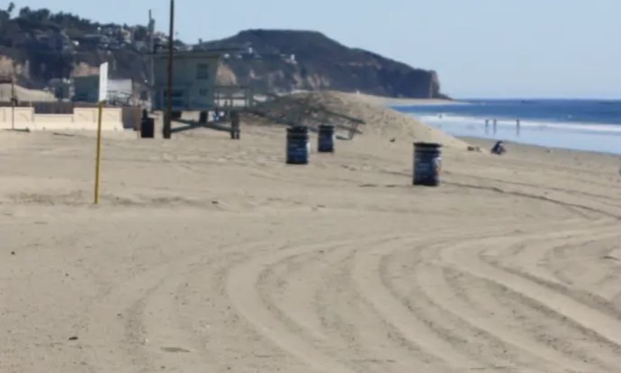 The wide pale sand of Zuma Beach in Malibu