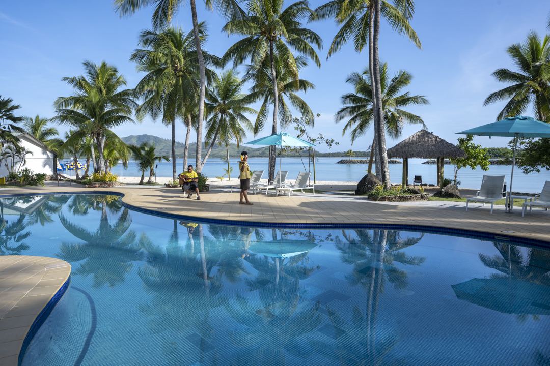 Calm lagoon water and pale sand on Malolo Island in the Mamanucas of Fiji