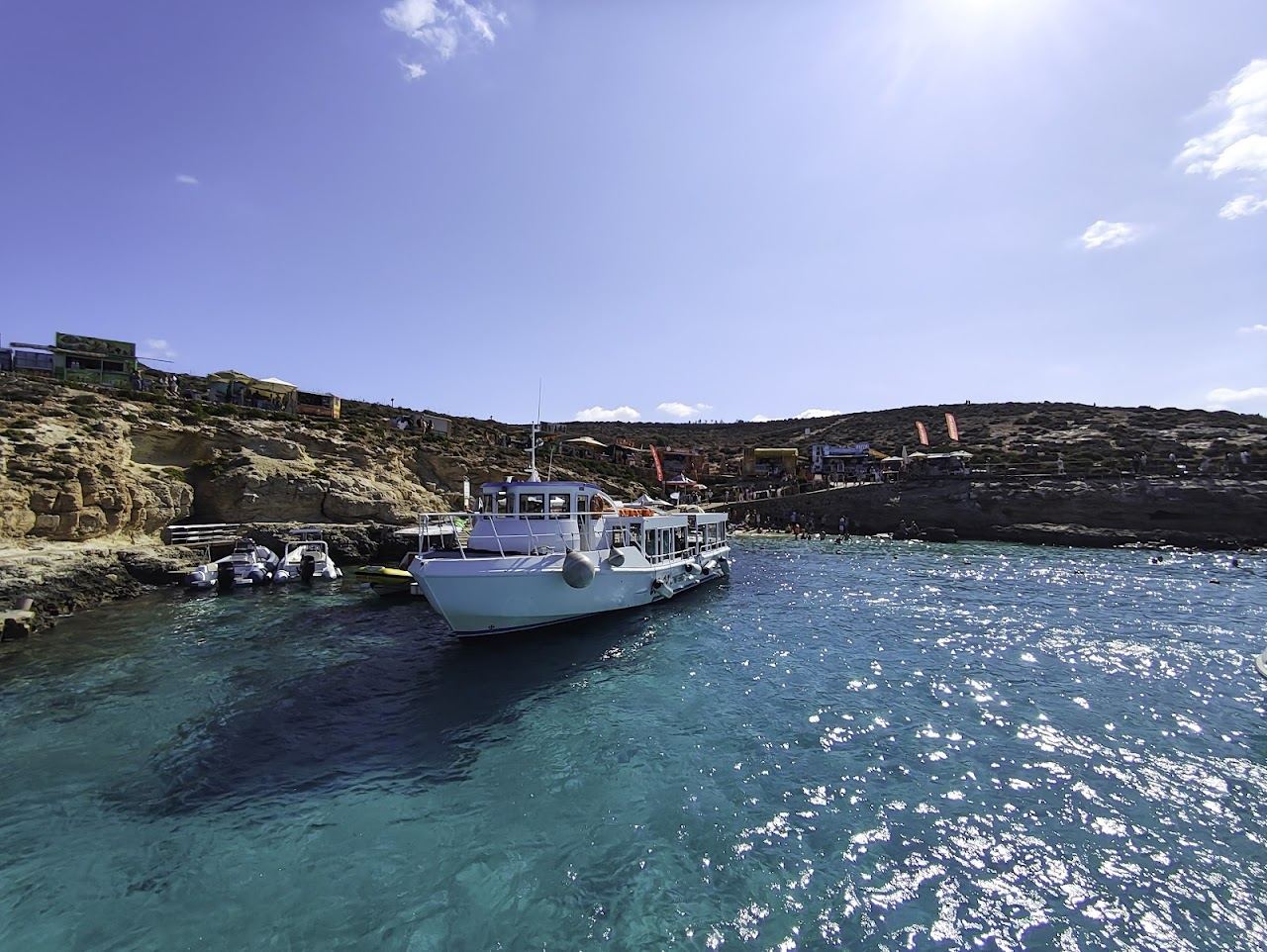 Calm clear turquoise water at a sheltered swimming beach in Malta