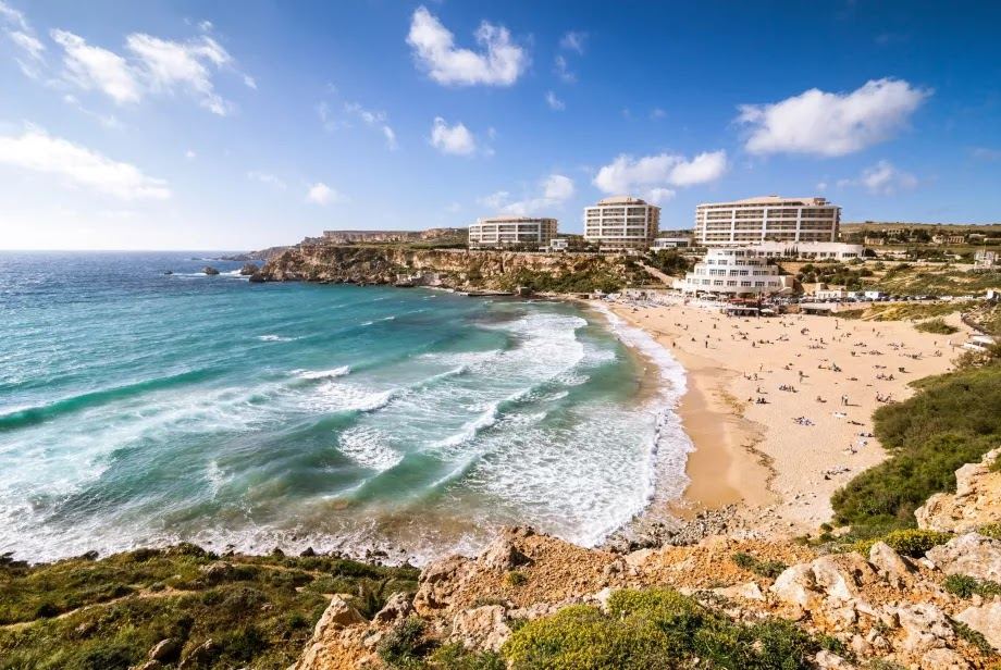 Golden Bay on the northwest coast of Malta, a wide sandy bay backed by clifftop hotels