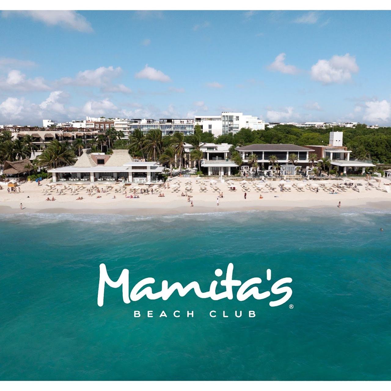 Daybeds, pool and loungers at Mamitas Beach Club on the sand in Playa del Carmen