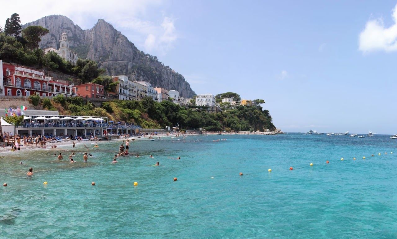 The long pebble beach of Marina Grande by the port in Capri
