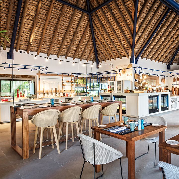 Day beds and a large pool above the lagoon at C Beach Club in Bel Ombre, Mauritius