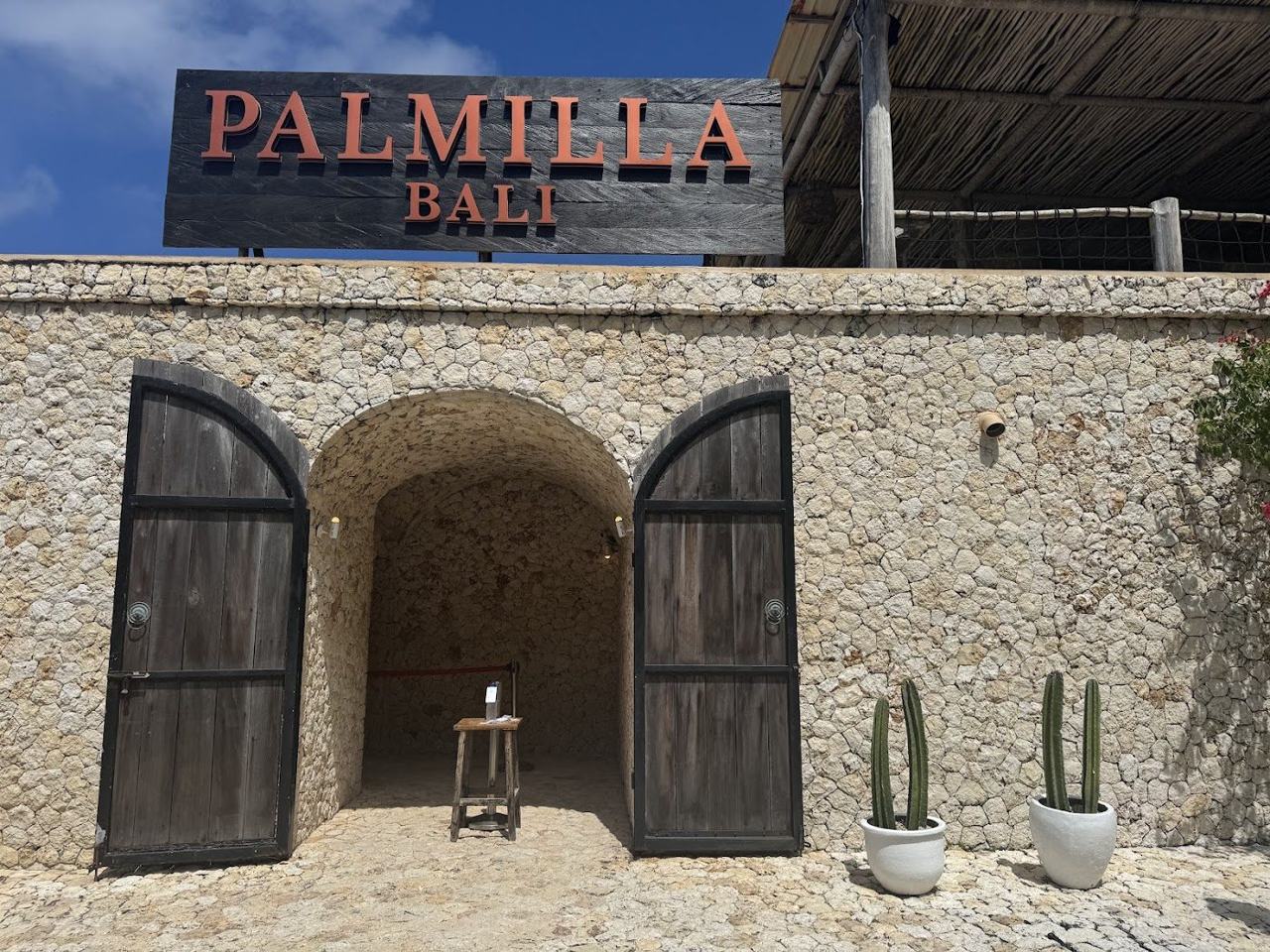 Beachfront pool and bamboo cabanas at Palmilla Bali Beach Club on Melasti Beach