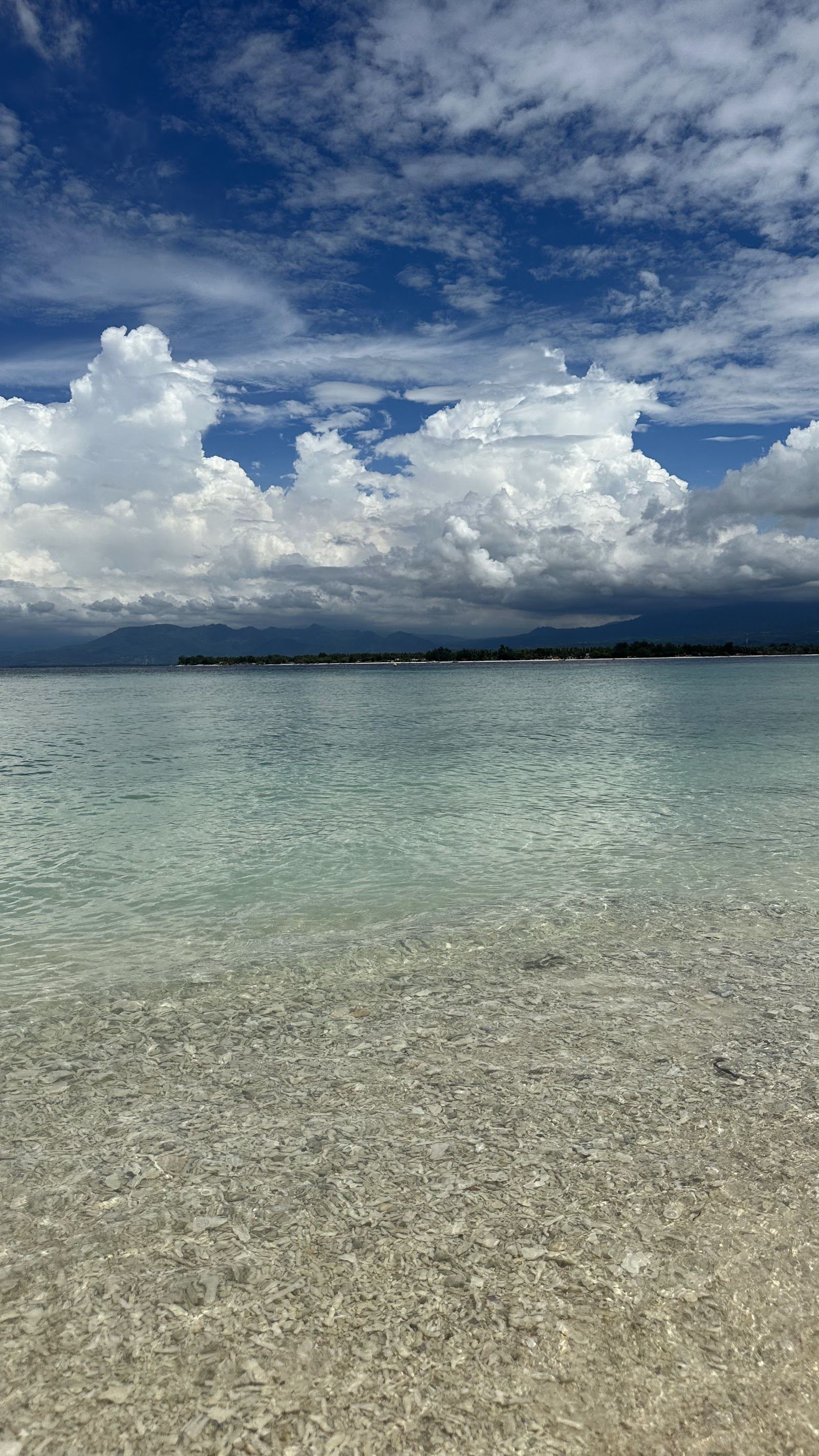 Calm clear shallows over coral at Turtle Point on the northeast shore of Gili Meno