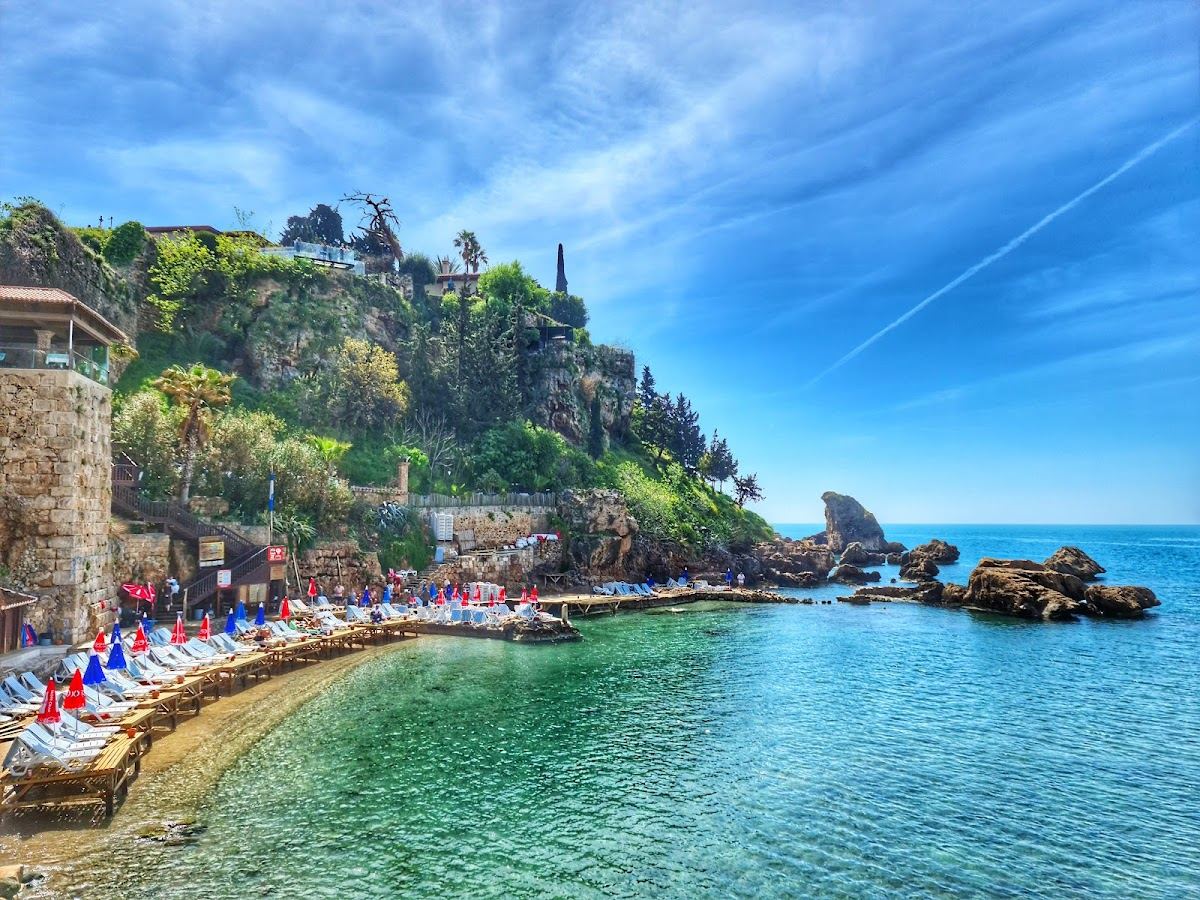 The sheltered Mermerli cove and its sunbeds below the Kaleici cliffs in Antalya old town