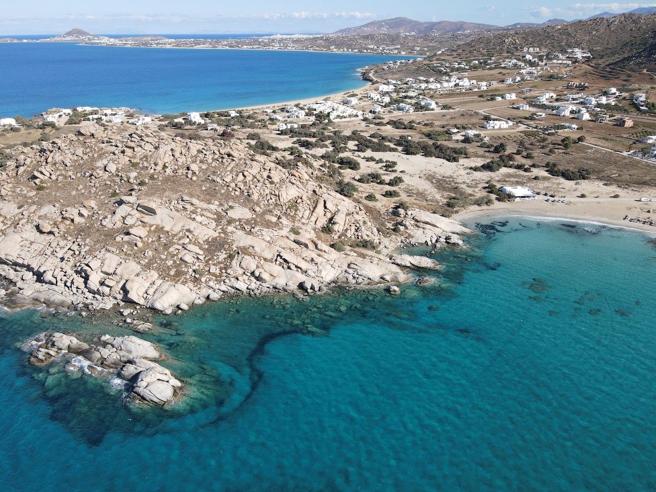 The twin bays and clear water of Mikri Vigla beach on the southwest coast of Naxos