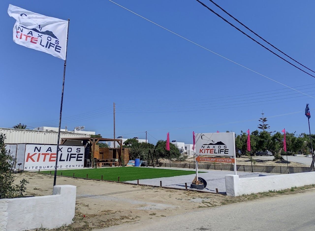Kitesurfers and golden sand at the open northern bay of Mikri Vigla in Naxos