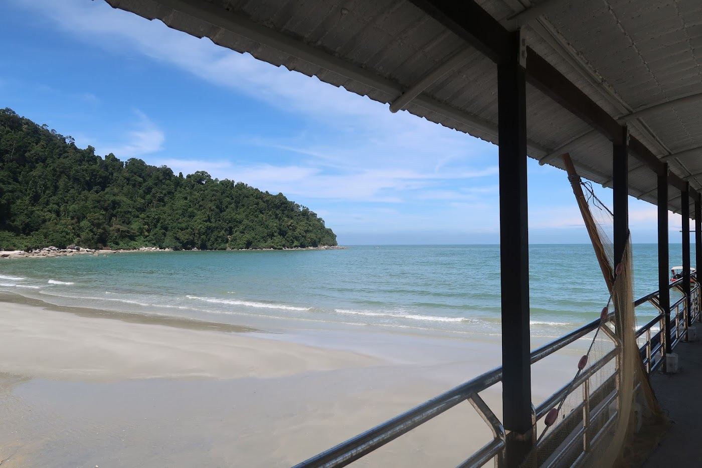 A local boat on the water near the Penang National Park coast at Teluk Bahang