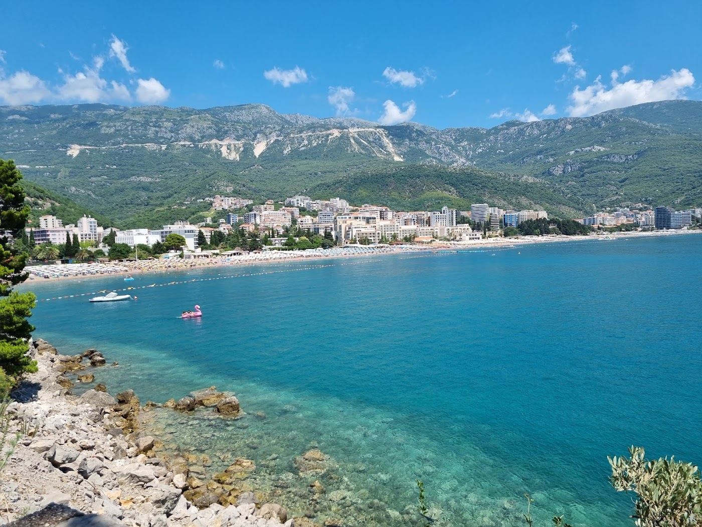 Soft sand and calm sheltered water at Becici beach near Budva on the Montenegro coast