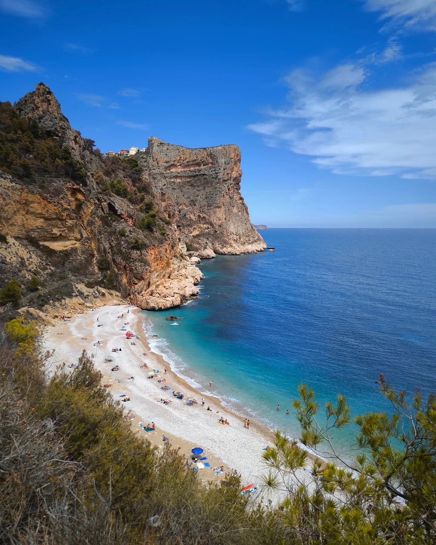 Cala del Moraig, the pebble cove under limestone cliffs near Benitatxell