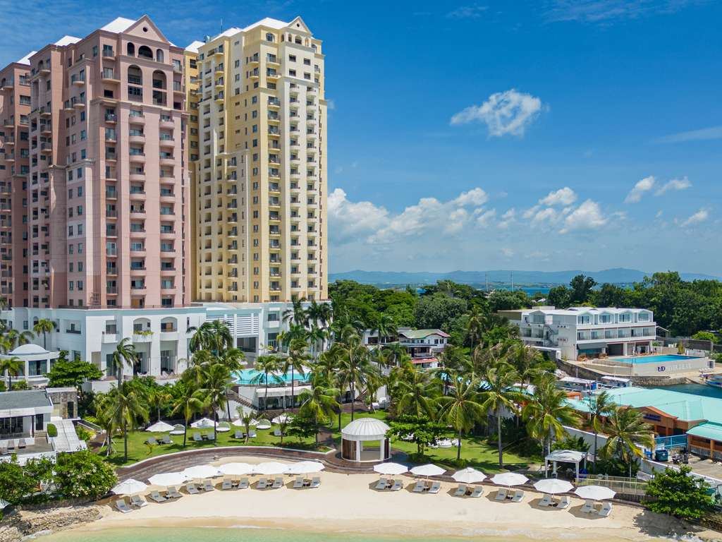 White sand beach and calm water at the Movenpick resort front on the Punta Engano tip of Mactan Island in Cebu Philippines
