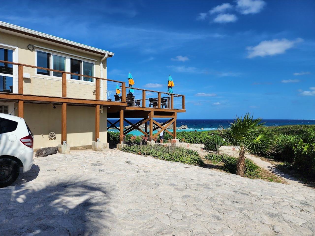 Mudjin Harbour limestone cliffs and surging turquoise water on Middle Caicos