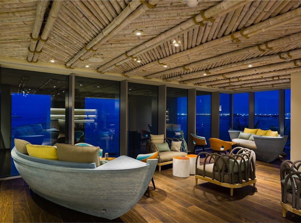 Beachfront loungers and lounge at Zale Beach Club in Al Mouj, Muscat
