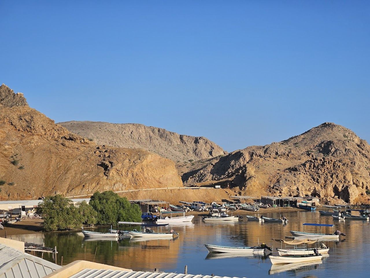 Clear calm water in a sheltered rocky cove at Bandar Khayran near Muscat