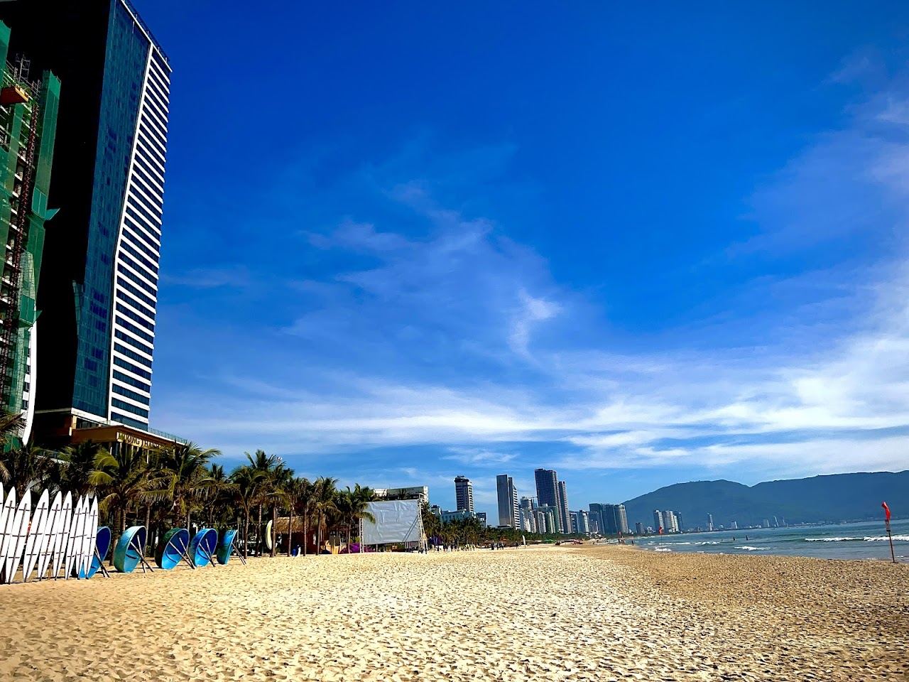 Soft white sand and gentle surf along the My Da stretch of My Khe Beach in Da Nang
