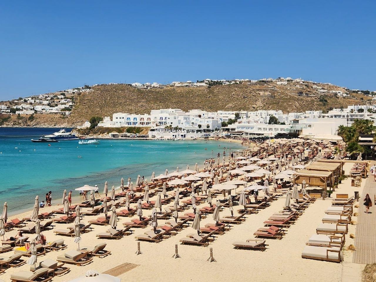 Organised sunbeds and calm water at Platis Gialos beach on the south coast of Mykonos