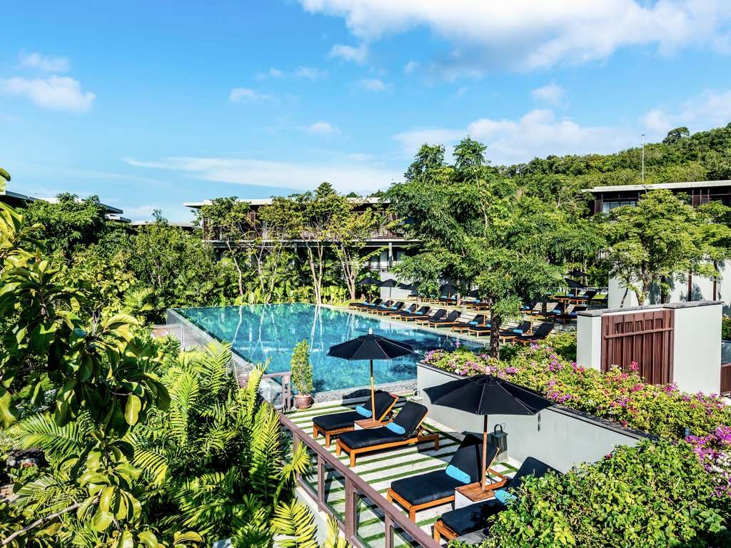 Loungers and sea view at a resort above Nai Thon Beach in Phuket
