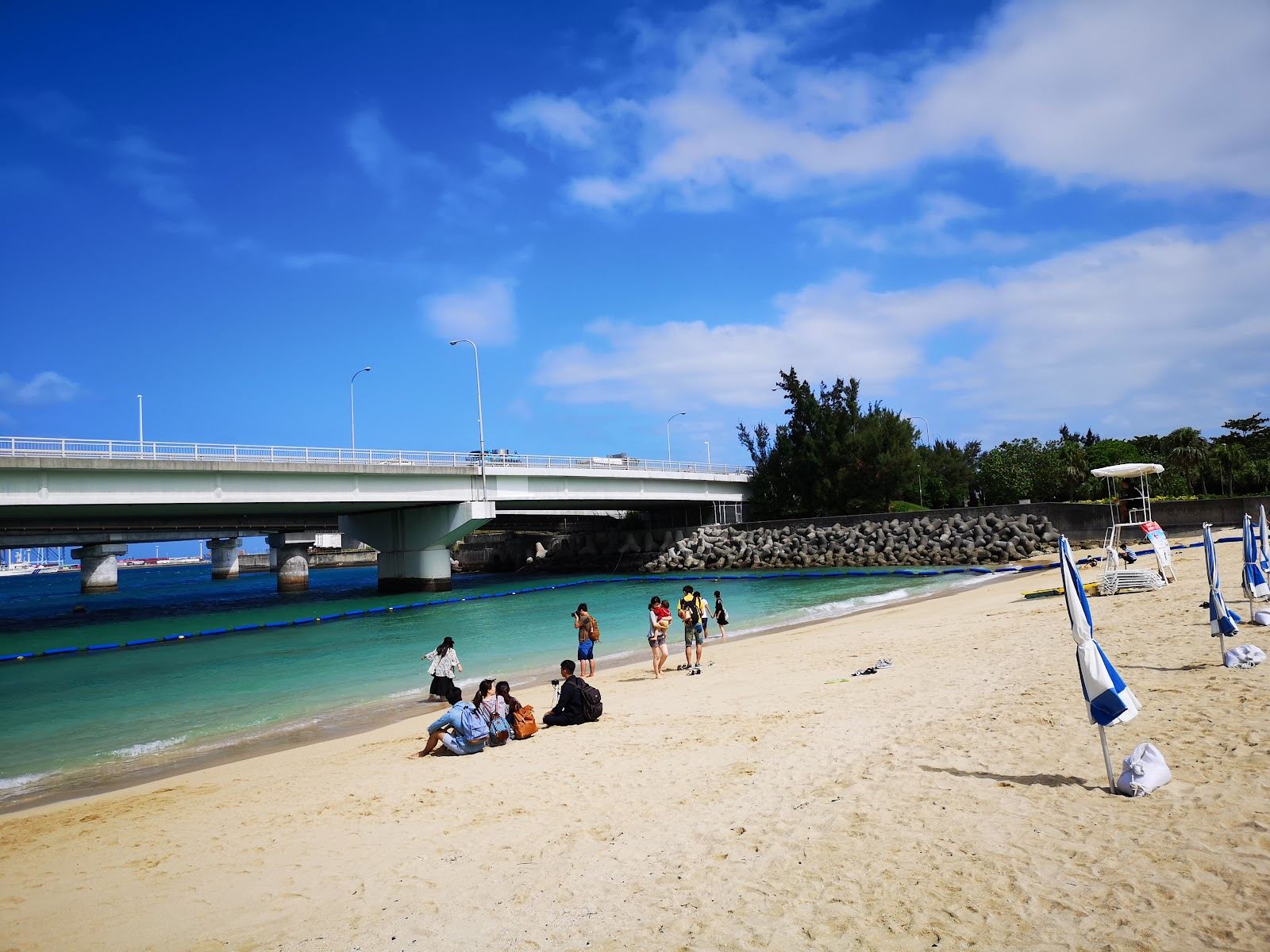 The netted swimming area and pale sand of Naminoue Beach in Naha, Okinawa
