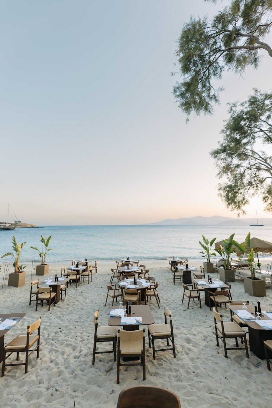 Sunbeds and beach bar setting at Santana Beach Club on Agia Anna beach in Naxos