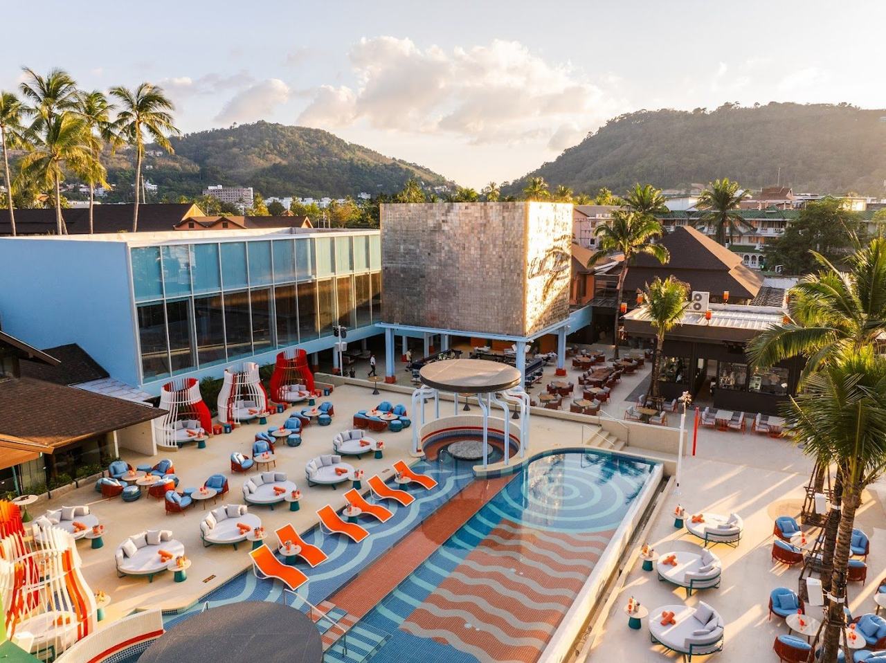 A new beach club with loungers and a pool near the sand at a Phuket resort