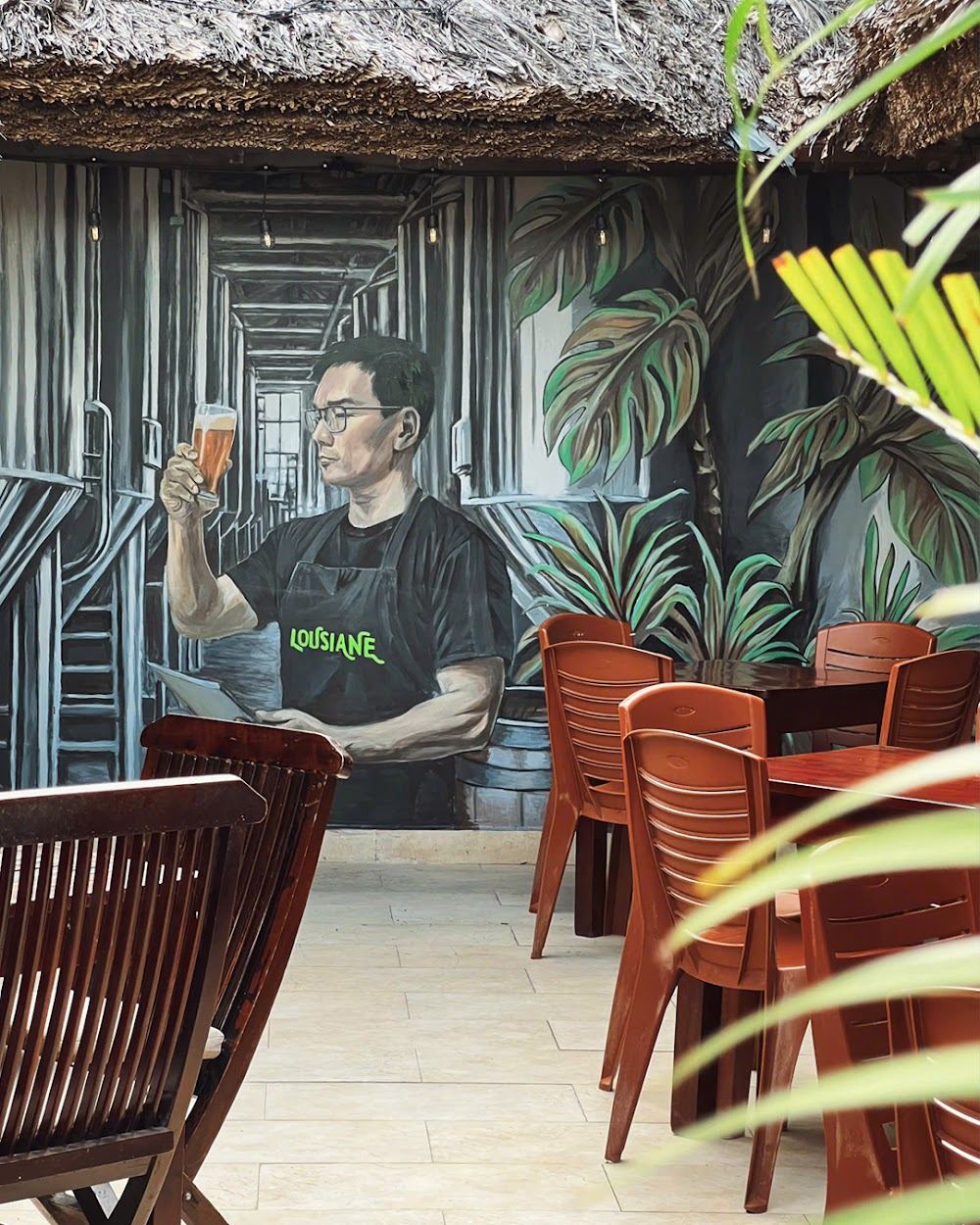 Beachfront pool and loungers at Louisiane Brewhouse on Nha Trang beach