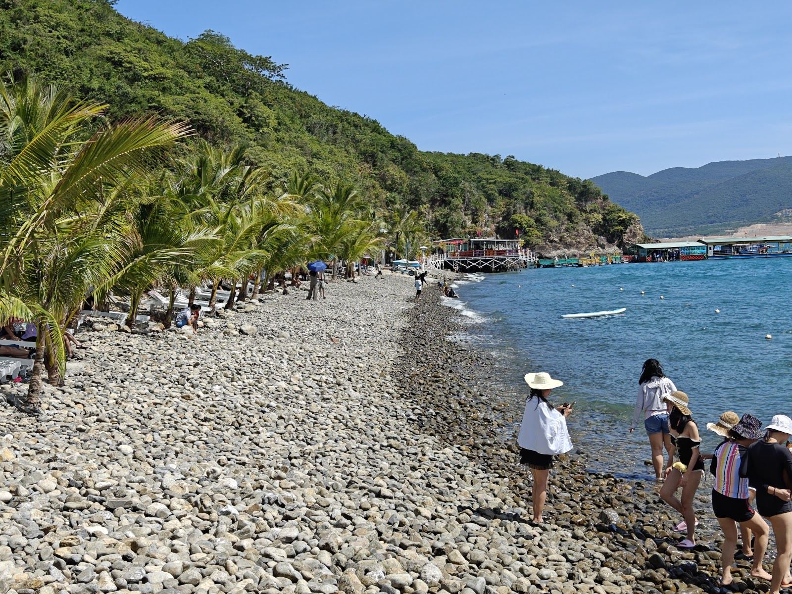 Soft sand and gentle water on a family beach along the Nha Trang seafront in Vietnam