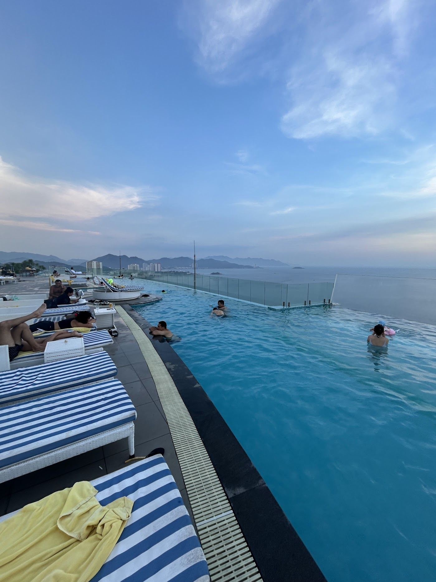 Calm morning light over Nha Trang bay and its long beach in Vietnam