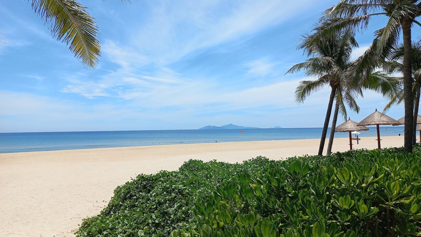 Soft sand and calm water at Non Nuoc Beach below the Marble Mountains in Da Nang