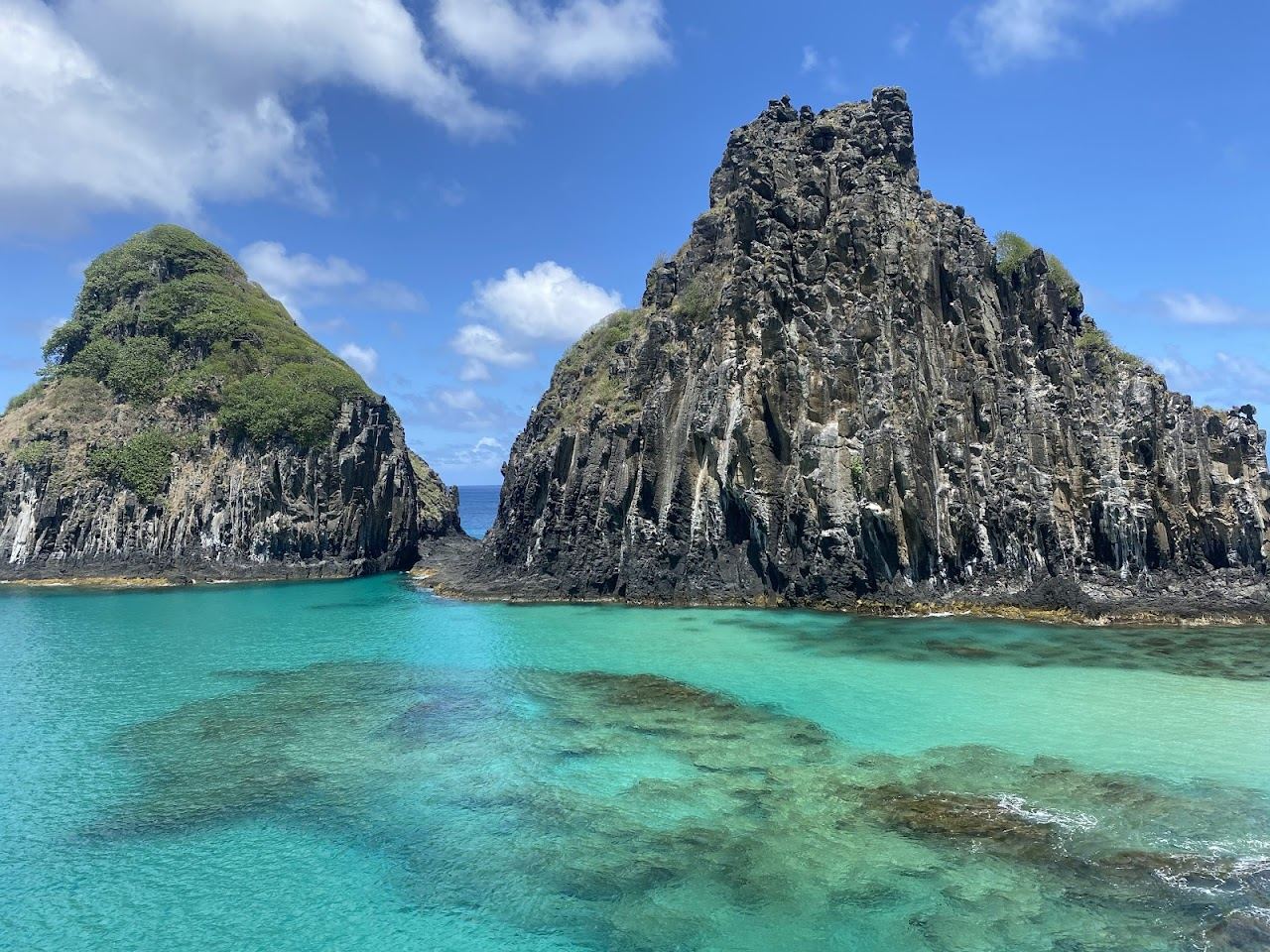 Clear natural pools at Baia dos Porcos on the calm side of Fernando de Noronha