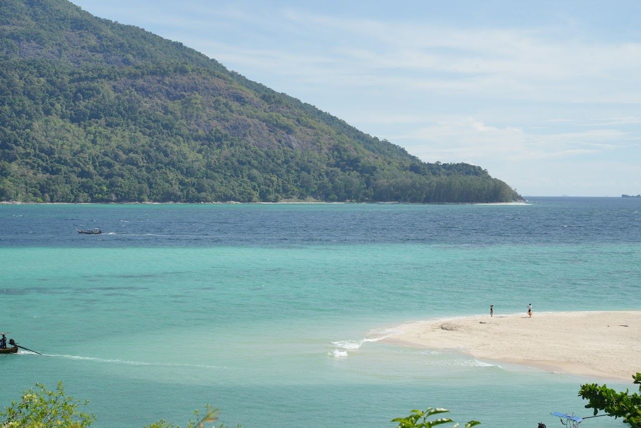The low tide sandbar reaching out from North Point Beach on Koh Lipe