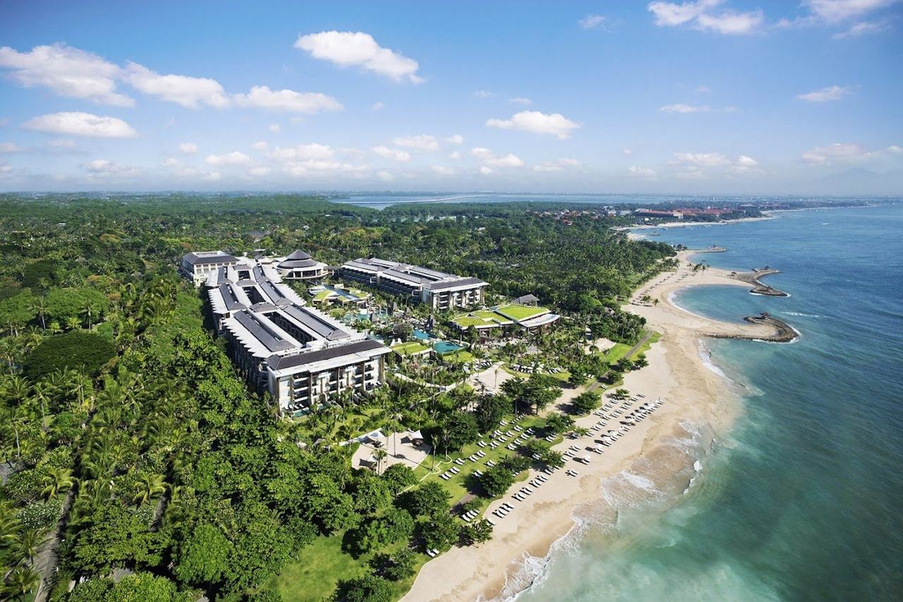 Beachfront pool and gardens at the Sofitel resort on Nusa Dua Beach in Bali