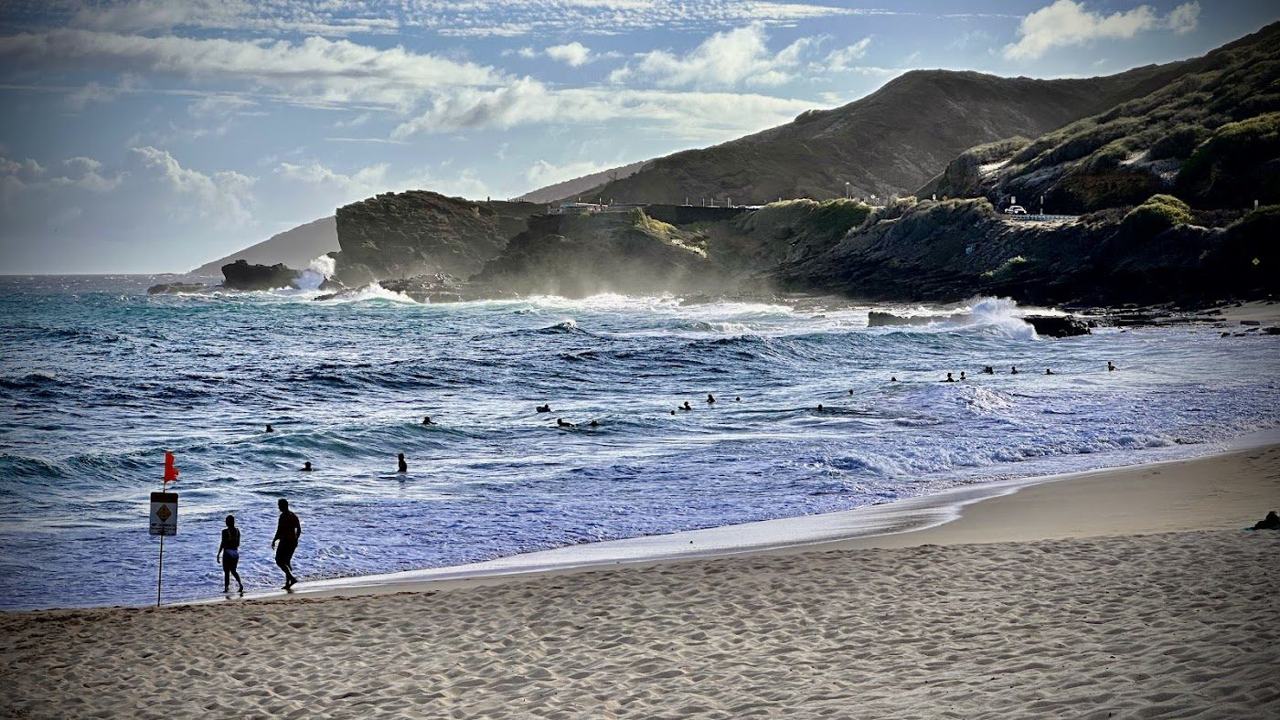 The golden sand and heavy shorebreak at Sandy Beach in southeast Oahu