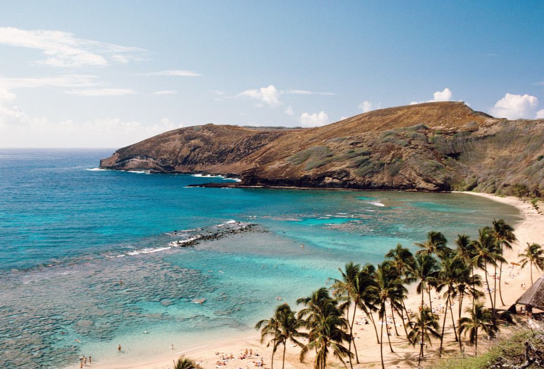 Clear turquoise water over reef inside a sheltered bay on Oahu