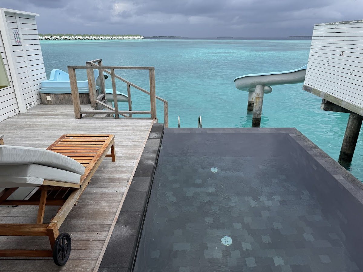 Overwater villas above a calm Maldives lagoon