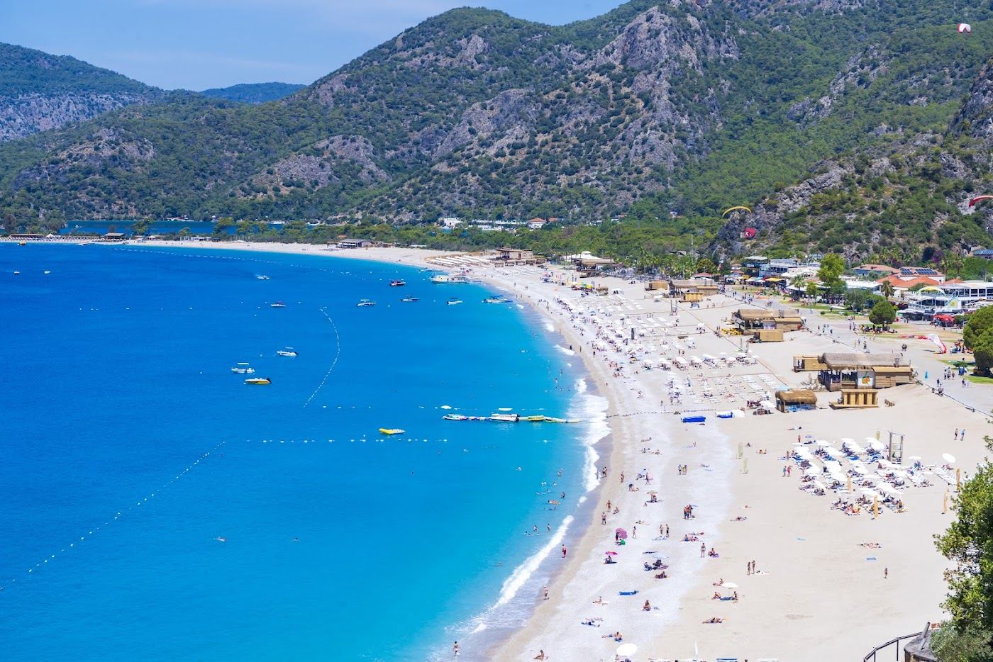 The free open shingle beach at Belcekiz in the heart of Oludeniz village near Fethiye in Turkey