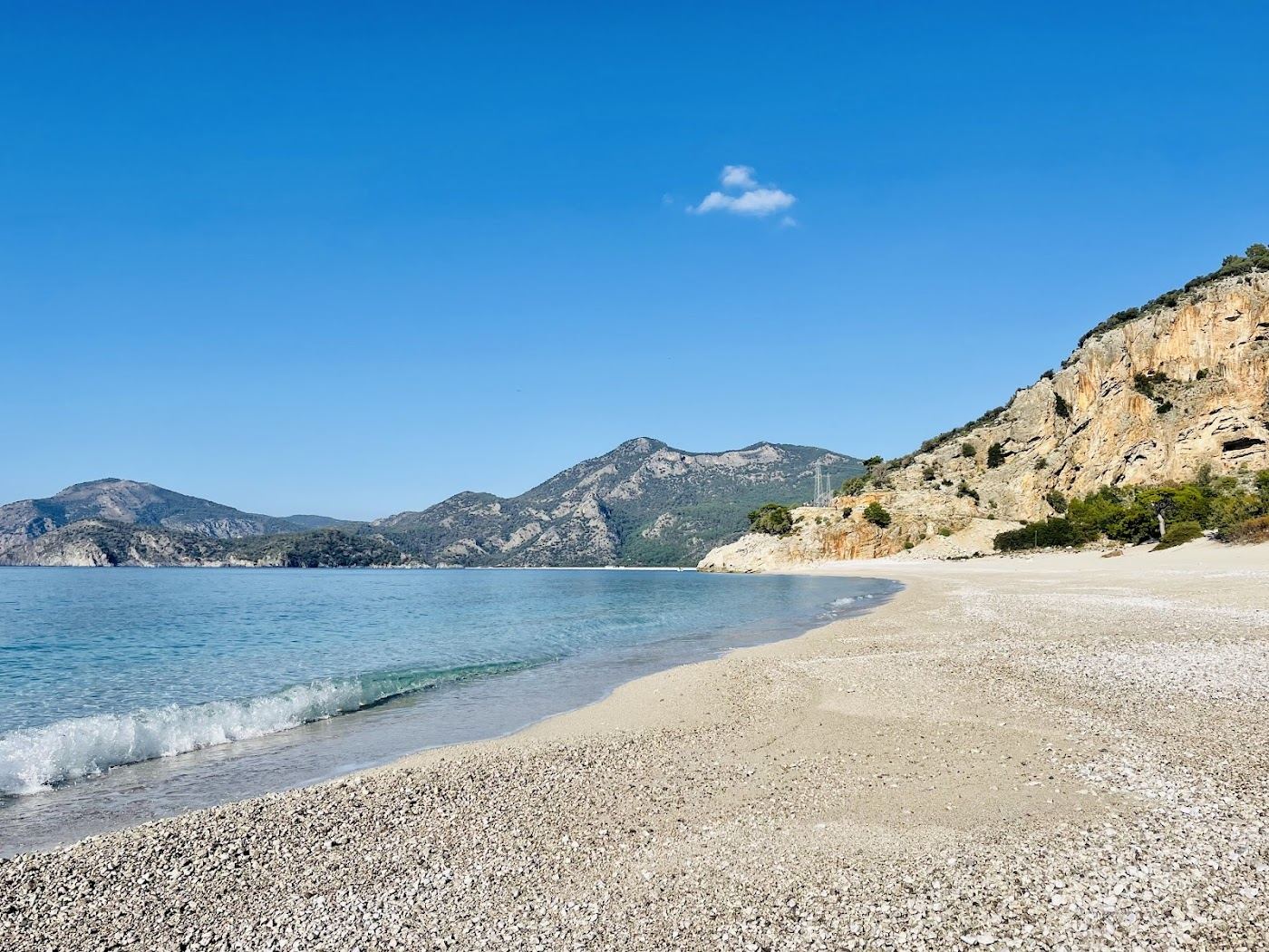 The quiet pine backed cove of Kidrak Beach inside the Oludeniz Nature Park near Fethiye in Turkey