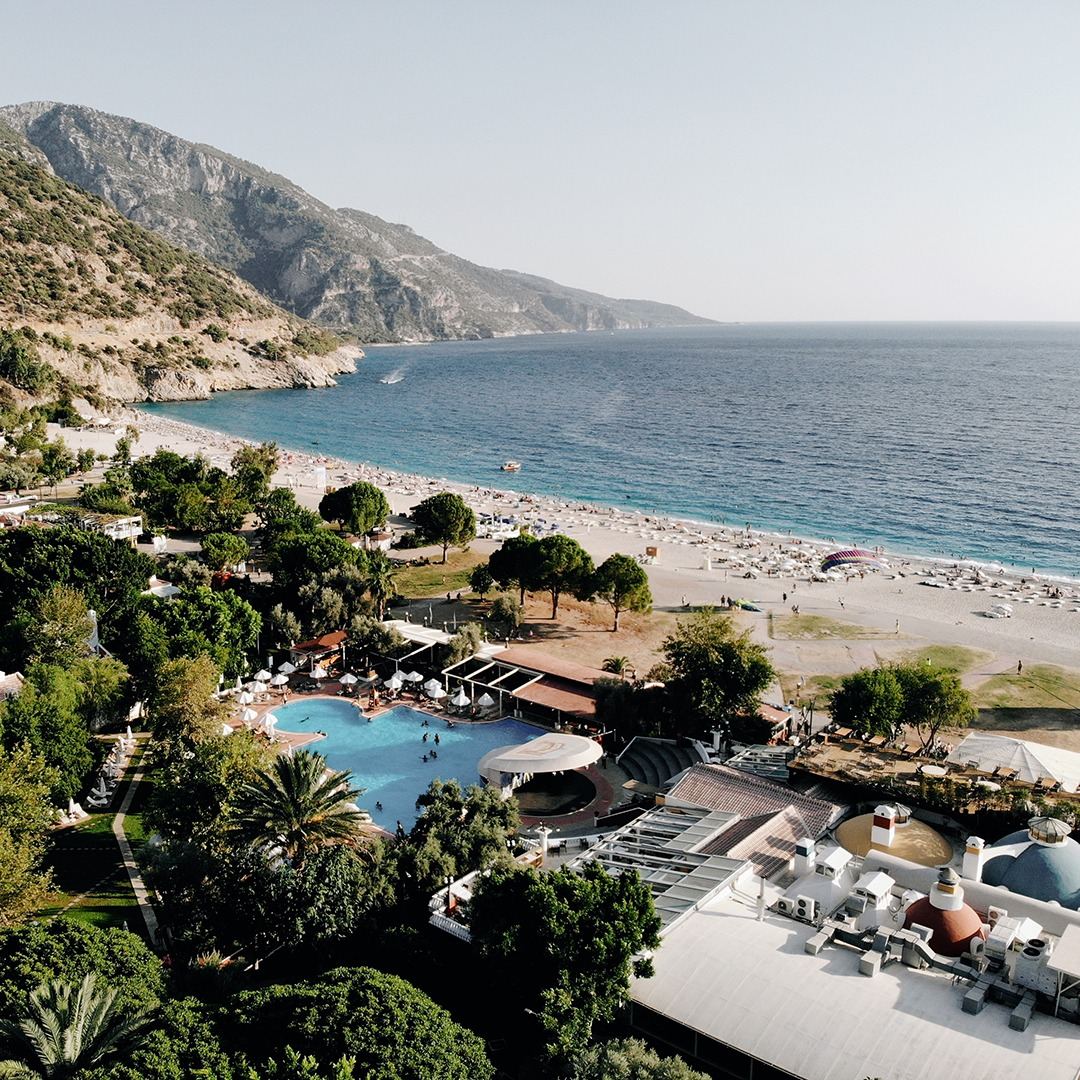The Belcekiz beachfront and its bars at Oludeniz with the lagoon beyond