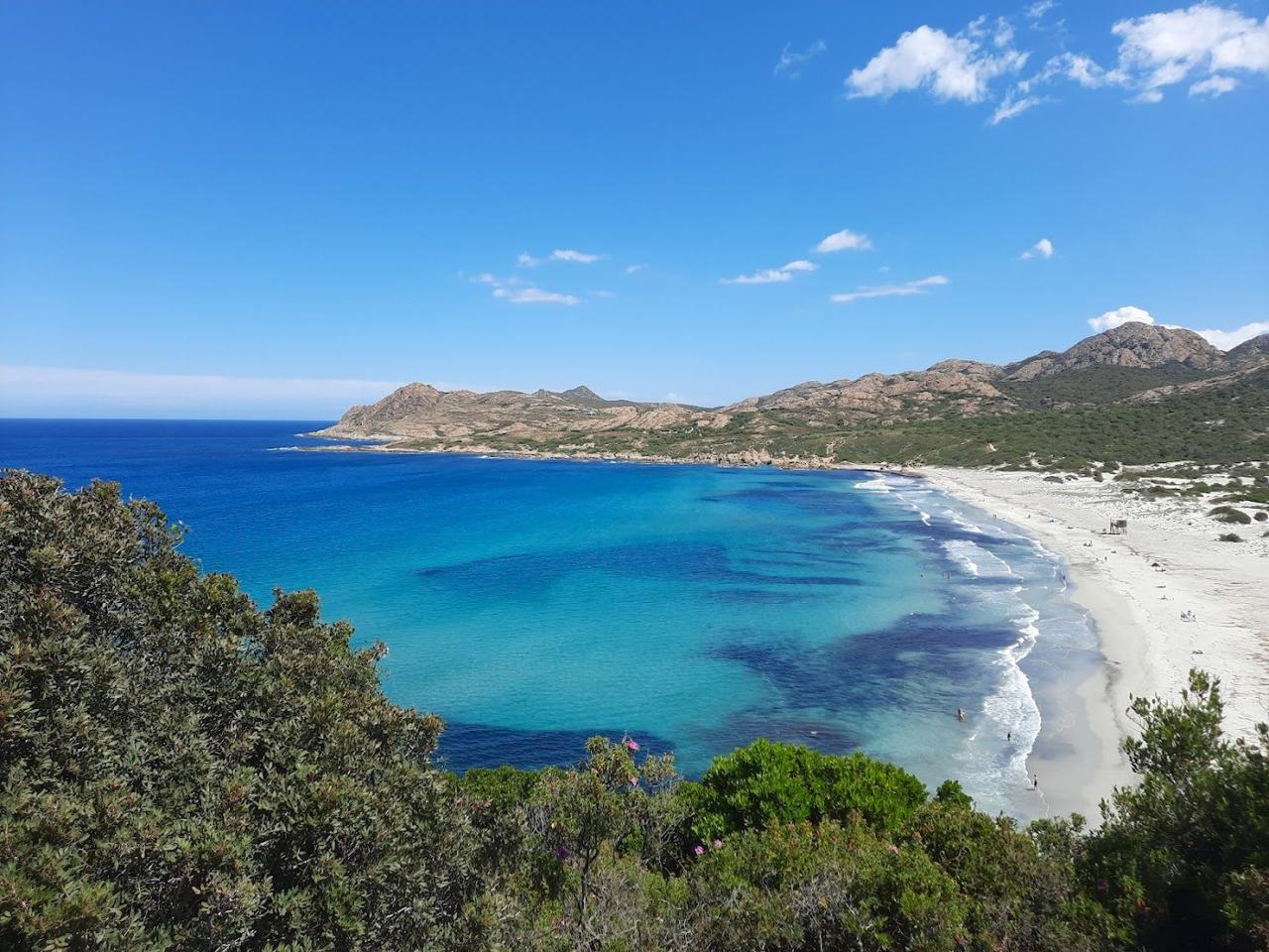 Golden sand, tall dunes and open sea at the wild Ostriconi beach at the edge of the Agriates in Corsica