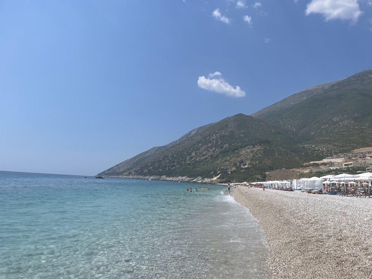 The bright pebble beach and deep blue water at Palase below the Llogara pass on the Albanian Riviera