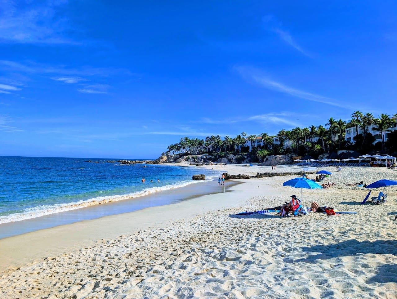 The calm bay and pale sand of Palmilla Beach on the Los Cabos corridor