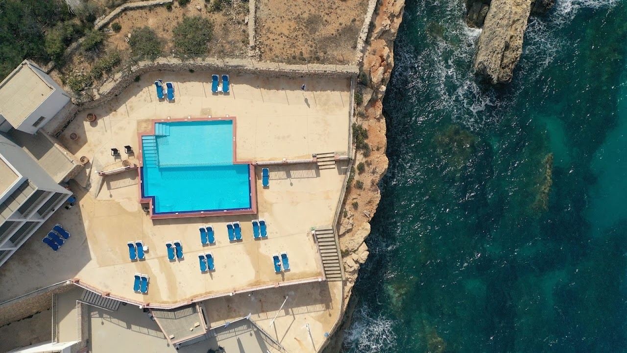 The sheltered golden sand cove of Paradise Bay near Cirkewwa at the northern tip of Malta