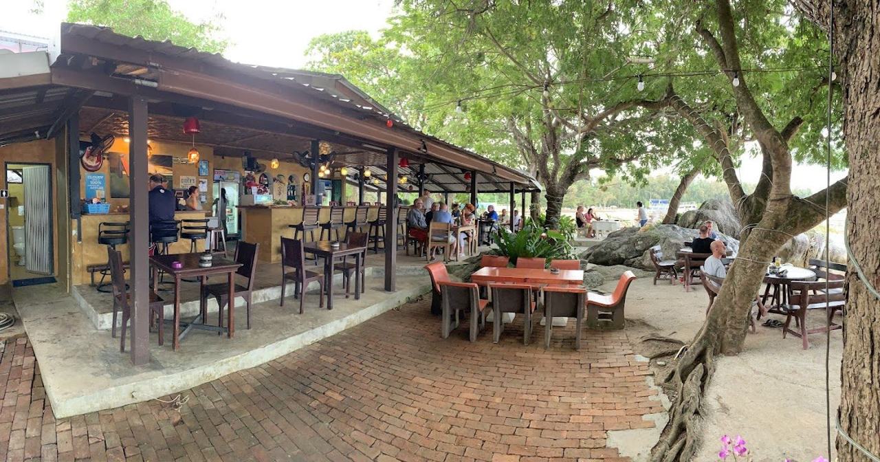 Bar and loungers on the sand at the managed Paradise Beach cove in Phuket