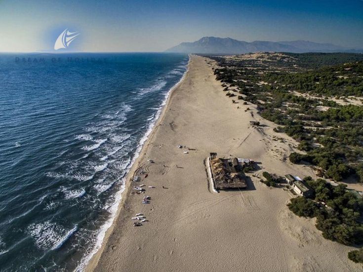 Wide open golden sand and shallow surf at Patara beach near Kalkan on the Lycian coast
