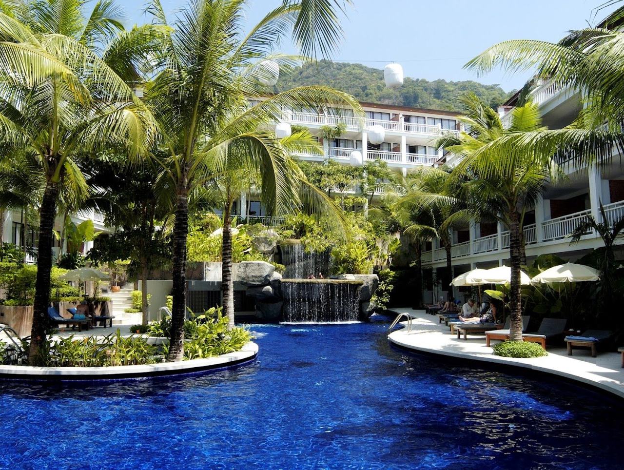 The wide curved bay and loungers at Patong Beach in Phuket