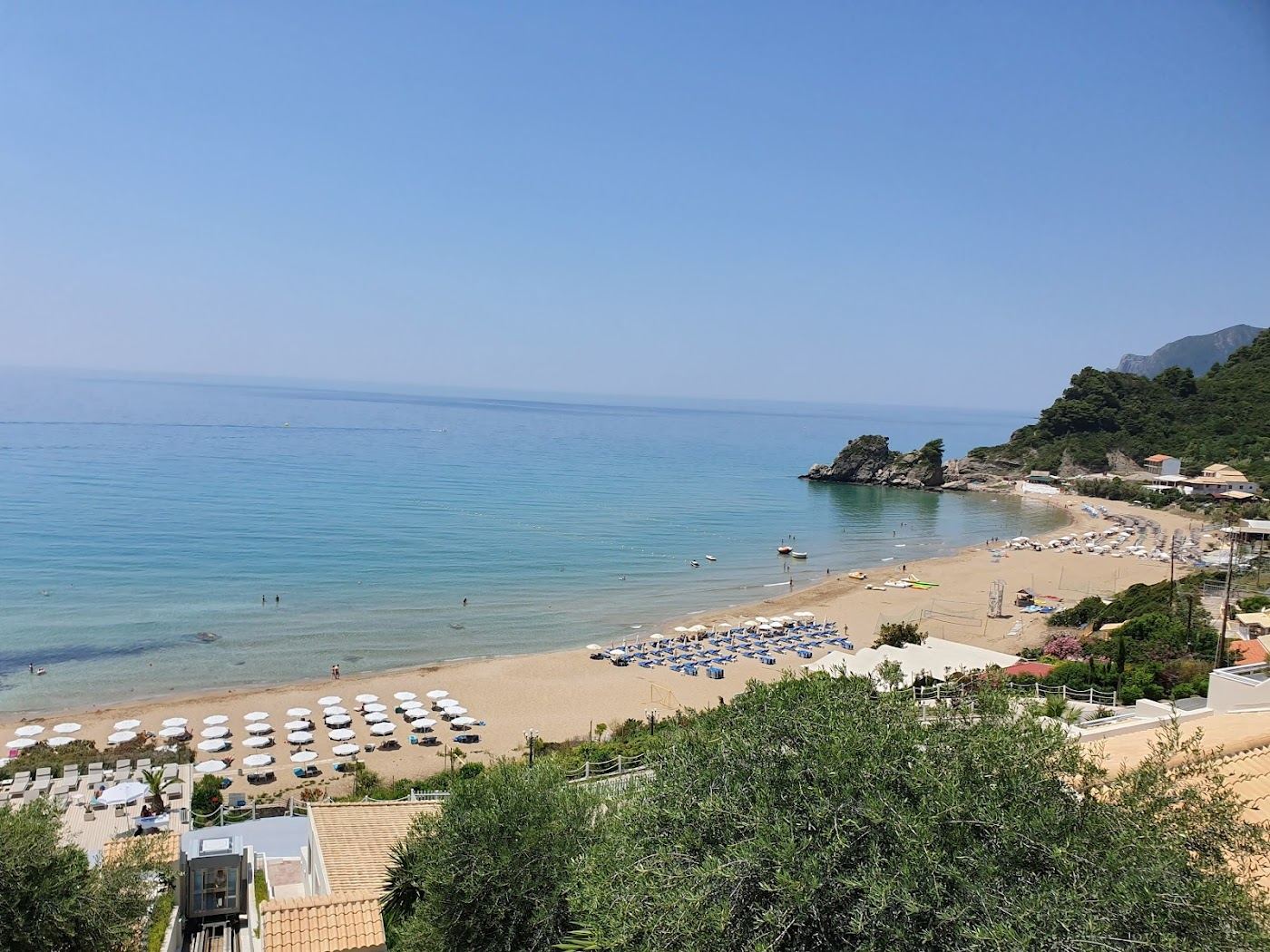 Golden sand and open water at Kontogialos beach below Pelekas in Corfu