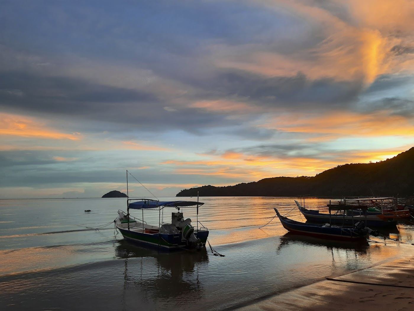 Sunset over the strait from a west facing fishing beach in Penang