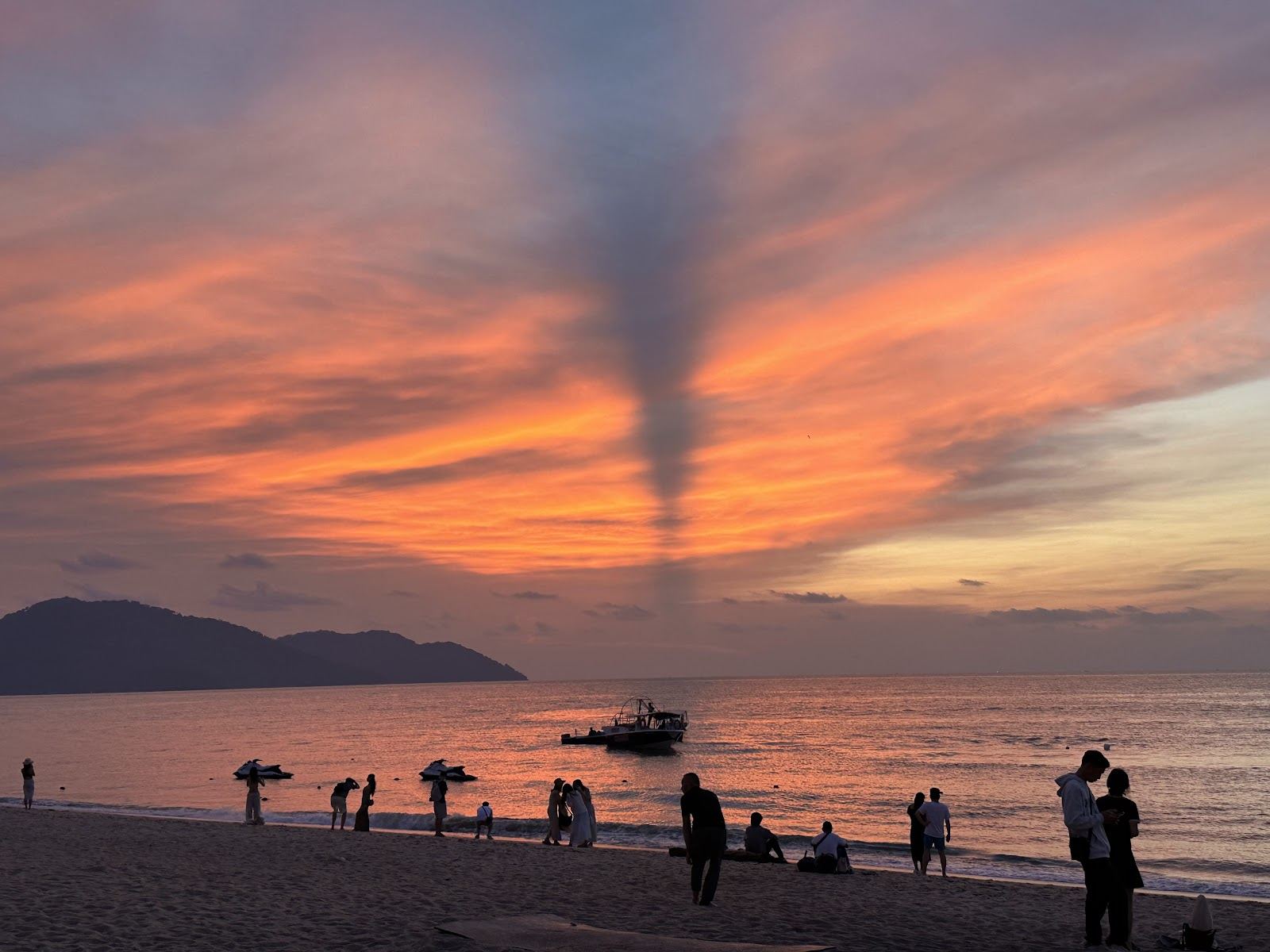 Warm sea and golden sand along the resort coast at Batu Ferringhi in Penang